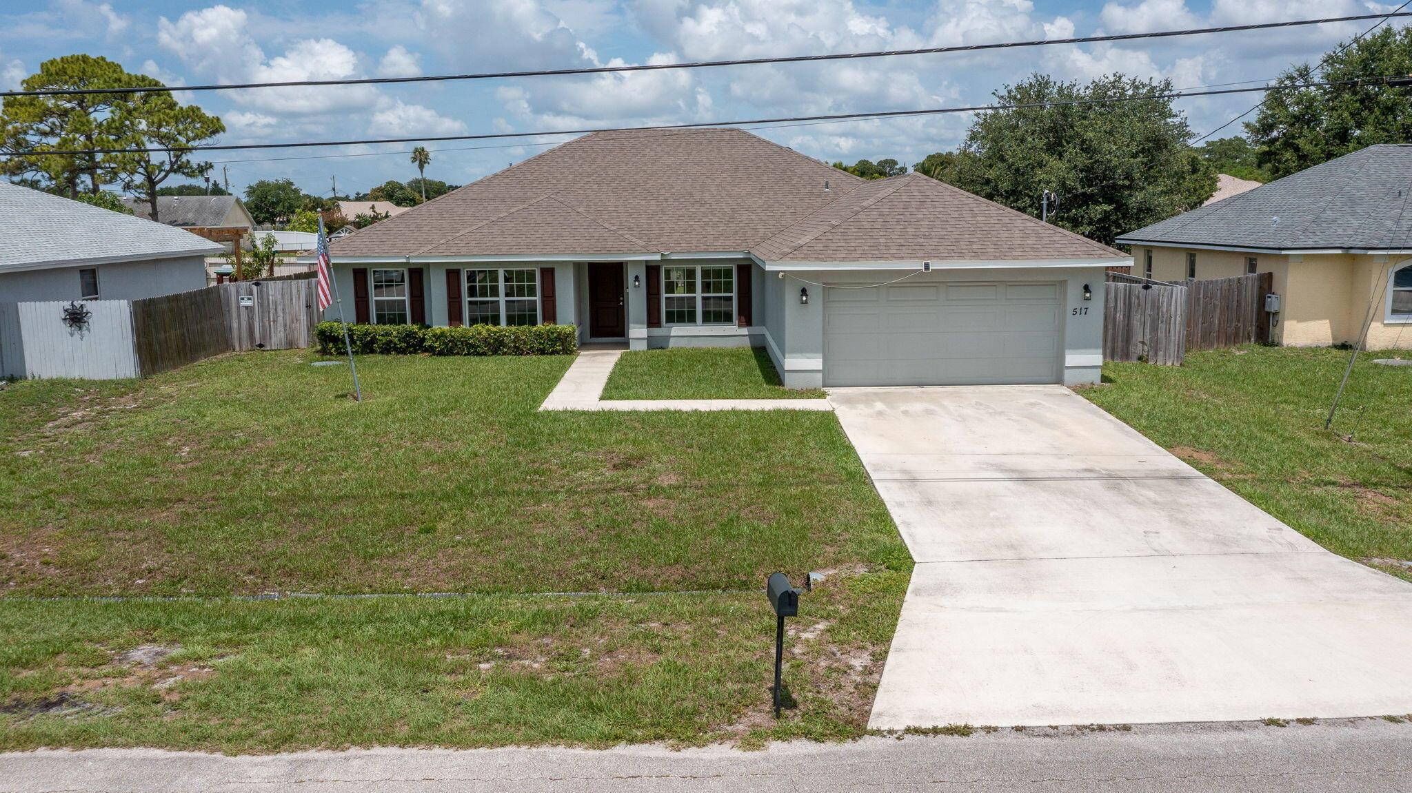 Welcome to modern living in the heart of Port Saint Lucie! Built in 2020, this beautifully maintained home offers over 2,500 sq ft of living space with a spacious layout. Featuring 4 bed plus den/office, and 2 bath, this home is ideal for families.Enjoy an open-concept design with natural light, a large kitchen perfect for entertaining, and a split floor plan that offers privacy and flexibility.Step outside to a generous backyard ready for your personal touch--room for a pool, garden, or outdoor retreat. Located in a quiet neighborhood with no HOA, minutes from shopping, schools and major highways.Don't miss this opportunity for a newer, move-in ready home!