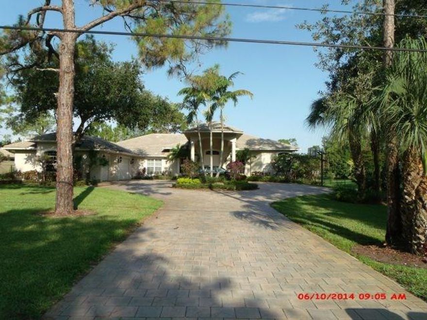 Stunning home located on 1.09 acres!  15,000 watt generator!! Some windows are high impact!!