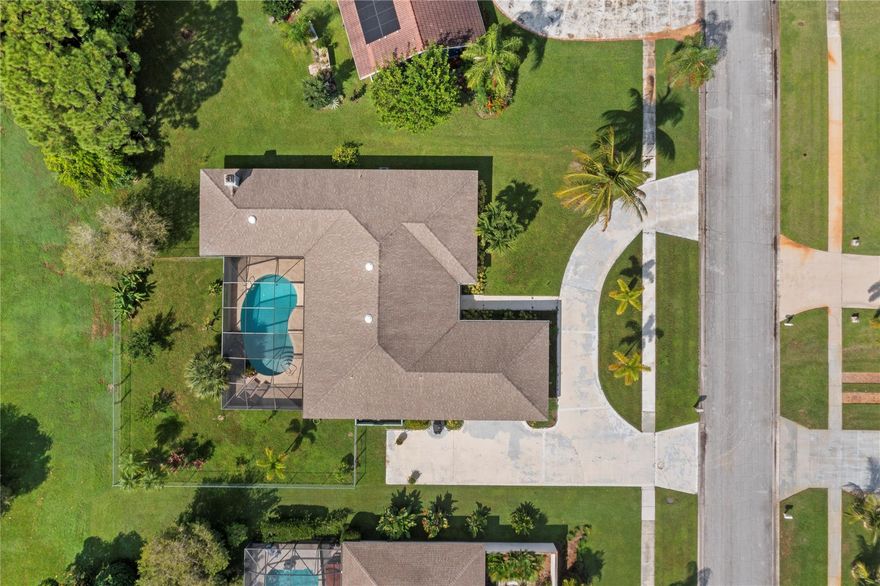 Located in the heart of Port St. Lucie is a beautiful 4-bedroom, 3-bathroom single-family home with 2,831 square feet of living space. This residence blends comfort with elegance. Inside, a bright and open living area exudes warmth and invites relaxation. Spacious bedrooms and well-appointed bathrooms provide room for both family and guests. The home’s inviting ambiance is perfect for making lasting memories. Enjoy a private backyard oasis with a refreshing pool—ideal for soaking up Florida’s sunshine. The lush landscape features fruitful trees, adding natural charm. Large circular driveway, which is suitable for parking an RV or boat. Fully fenced back yard. A must-see!