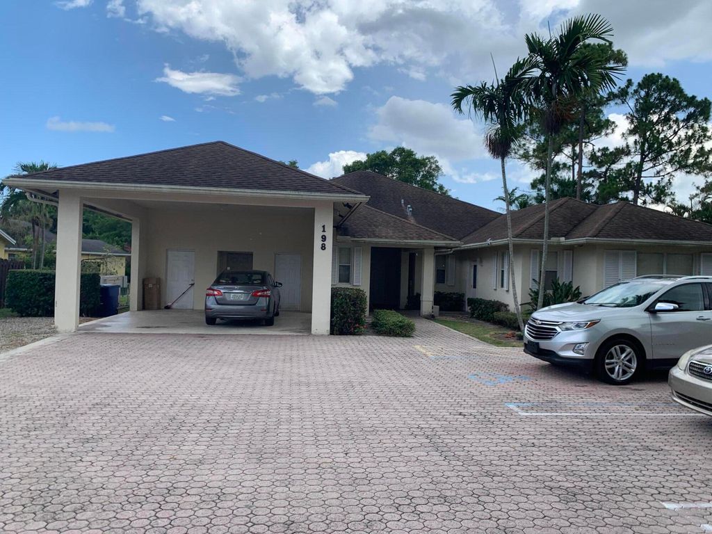 Photo of 198 Sparrow Drive, Royal Palm Beach, FL 33411 (MLS # B26043190)