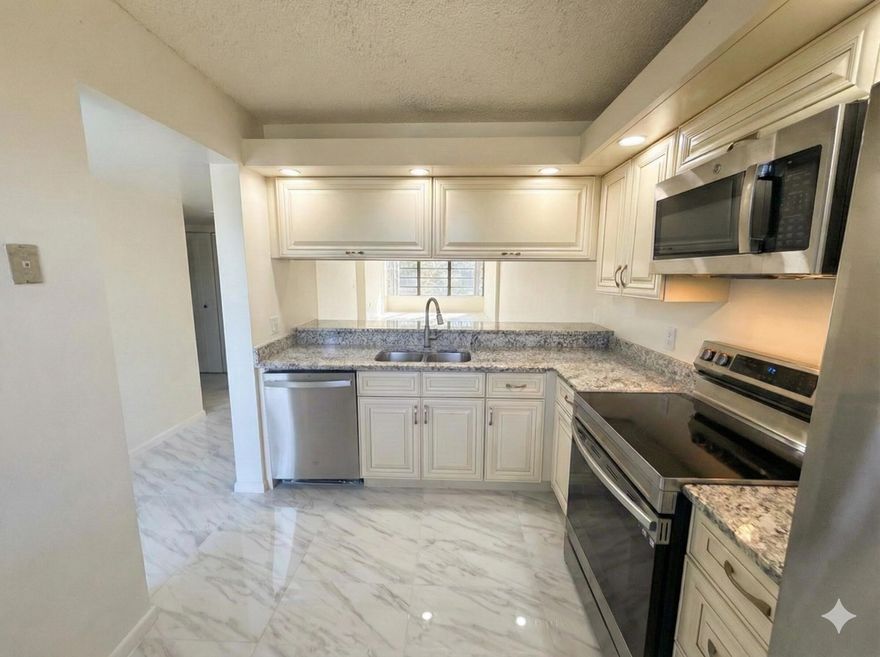 One of the most extensively renovated units currently available in Whitehall. Beautifully updated 2-bedroom, 2-bath residence featuring new ceramic tile floors throughout, fresh interior paint, brand-new kitchen appliances, refinished cabinets, new bathroom countertop and toilet, and new washer and dryer. Spacious split-bedroom layout with bright living areas, large laundry room, and additional space ideal for storage or a home office. Desirable 3rd-floor unit in a gated community with clubhouse, pool, tennis courts, and 24-hour security. HOA includes water, cable, exterior insurance, and amenities. Centrally located near downtown West Palm Beach, CityPlace, Palm Beach Outlets, and major highways. Vacant and easy to show.