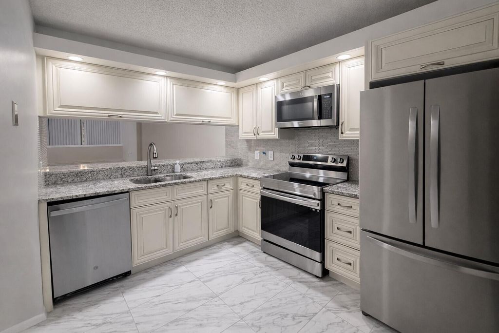 Photo of 3826 Whitehall Drive #305, West Palm Beach, FL 33401 (MLS # R11166693)