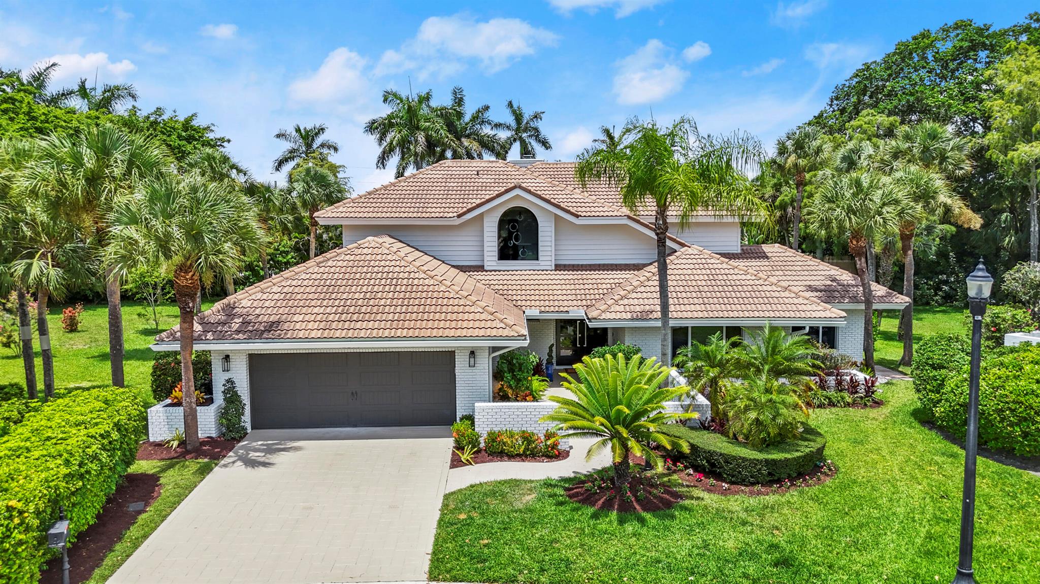 ENJOY THIS PROPERTY AS IT EXUDES A VACATION VIBE. EACH WING PROVIDES PRIVACY IN THIS 4 BEDROOM + OFFICE, 3 1 2/ BATH HOME. THE PRIMARY BEDROOM LOCATED ON THE 2ND FLOOR FEELS LIKE A TREETOP RETREAT WITH BALCONY - ALSO HAS A SITTING AREA. ADDITIONAL BEDROOM AND FULL BATHROOM UPSTAIRS. MODERN GLASS STAIRCASE. NEW KITCHEN WITH QUARTZITE AND 2 OVENS. PRIVATE OFFICE OR PLAYROOM ON MAIN LEVEL WITH SLIDING DOORS LEADING TO PATIO. THE BACKYARD FEATURES A HEATED POOL WITH JACUZZI, COMPLETE MARBLE PATIO, AND SUMMER KITCHEN. PLENTY OF OVERHANG FOR DINING AND PLAYING. IMPACT GLASS THROUGHOUT - EXCEPT 1 WINDOW IN GARAGE. CUL DE SAC LOCATION. MASSIVE SIDE YARD. WOOD BURNING FIREPLACE IN FAMILY ROOM.