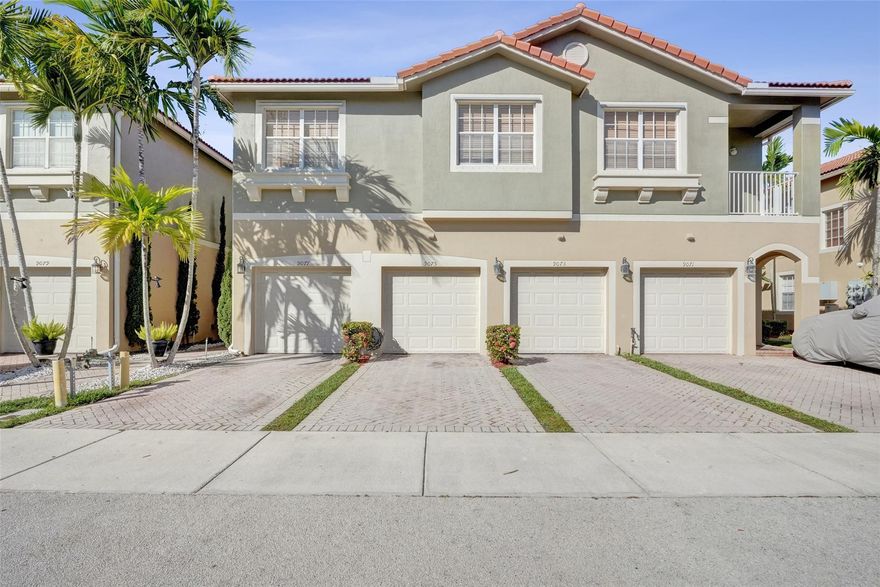 RARE CORNER 3-bedroom unit with PRIVATE GARAGE.  Features include LAMINATE WOOD FLOORS, UPDATED KITCHEN; OPEN CONCEPT LR/DR; SPLIT BEDROOM PLAN; SPACIOUS MASTER SUITE with WALK IN CLOSET & PRIVATE BALCONY with garden views. FULL SIZE WASHER/DRYER. Bright open layout perfect for entertaining! Located in a gated resort-style community with clubhouse, pool, and gym. Prime location near Sawgrass Expressway, Turnpike, Sawgrass Mills, Top Schools, shopping, dining, and minutes to the beach.