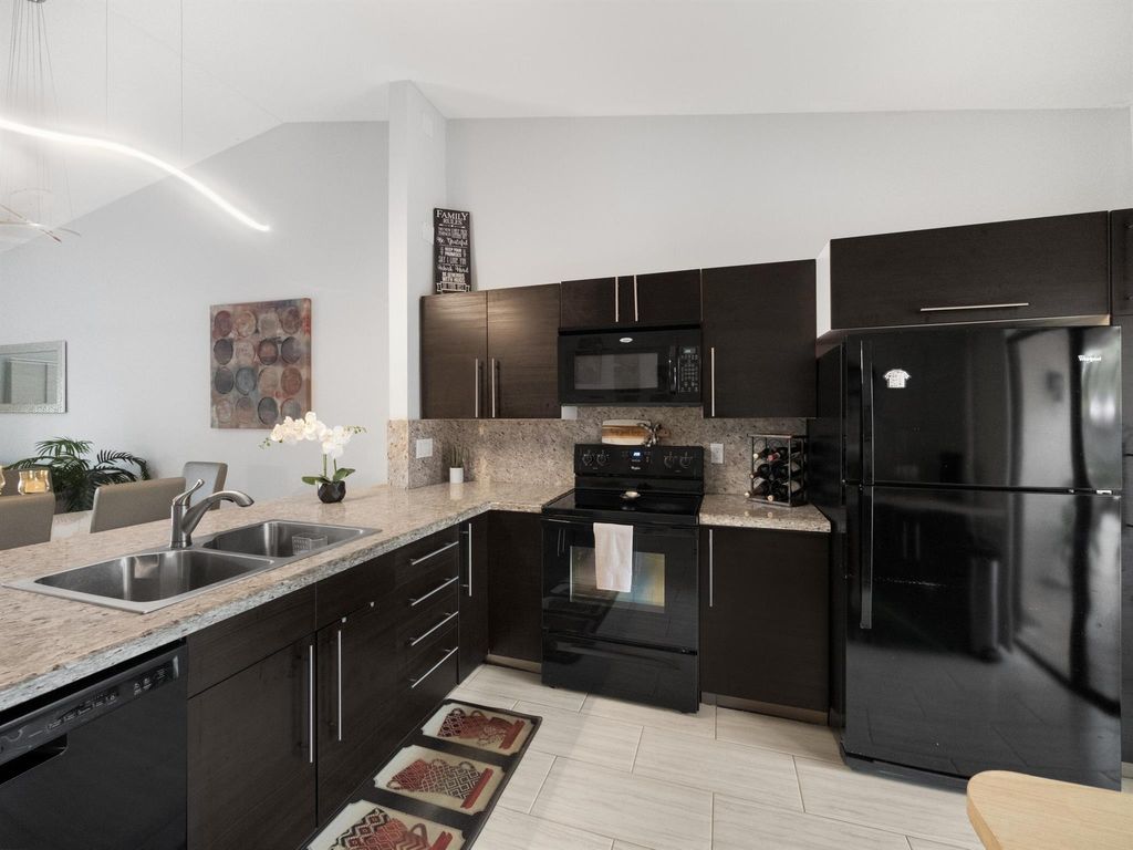 Photo of 5217 E Lakes Drive, Deerfield Beach, FL 33064 (MLS # R10942533)