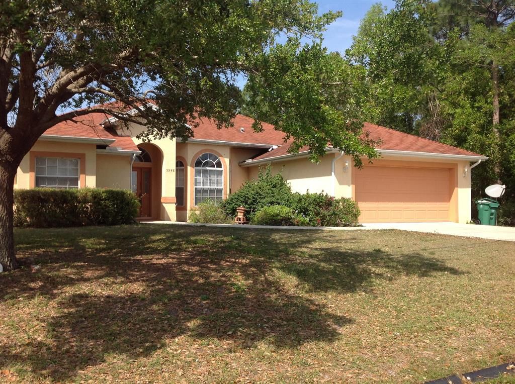 Photo of 5948 NW Hann Drive, Port Saint Lucie, FL 34986 (MLS # R10703268)