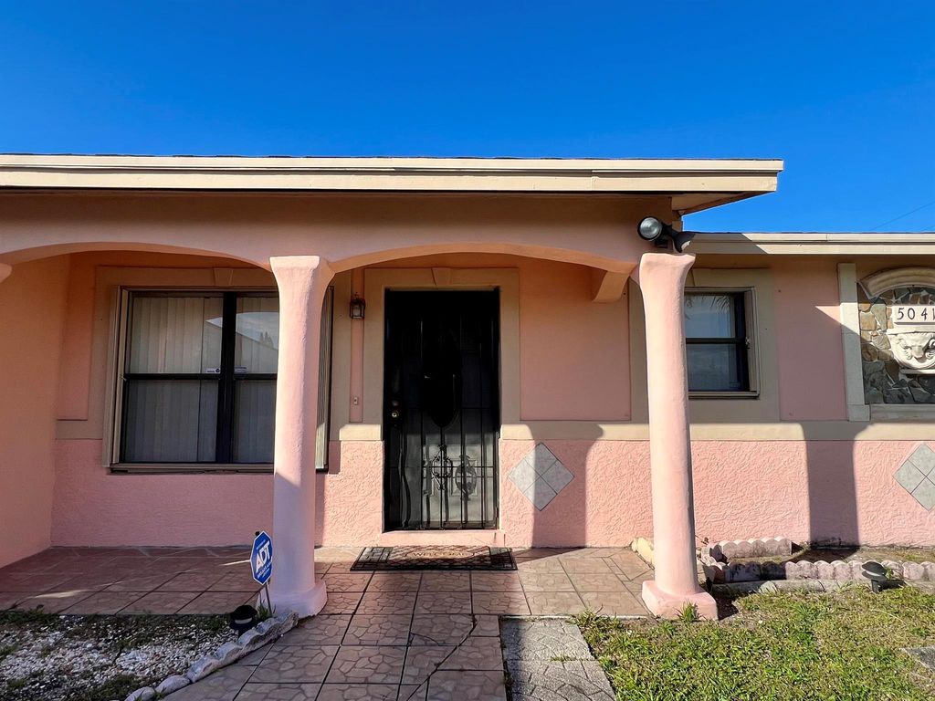 Photo of 5041 Pat Place, West Palm Beach, FL 33407 (MLS # R10944965)