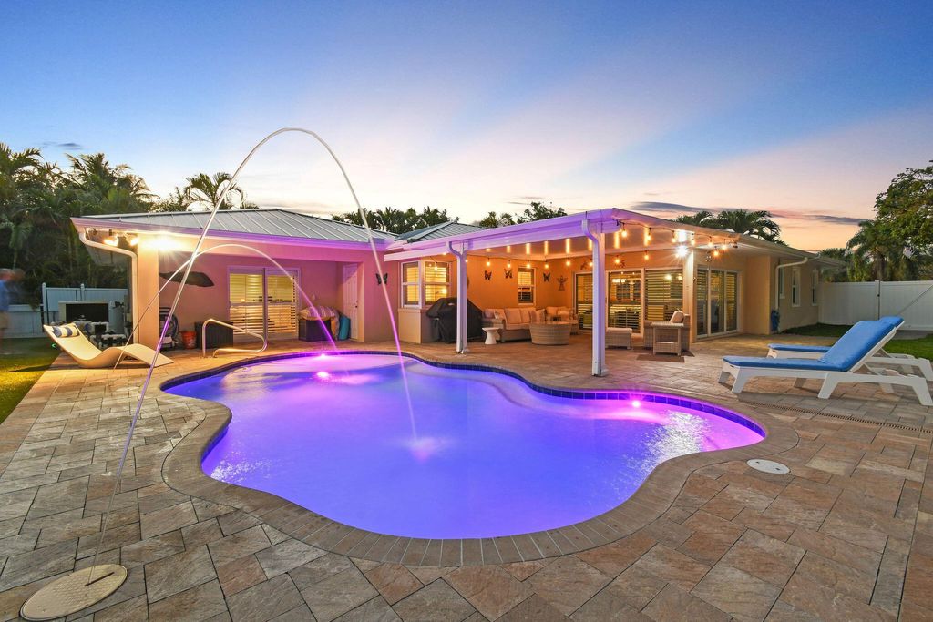 Photo of 304 Claremont Lane, Palm Beach Shores, FL 33404 (MLS # R10955301)