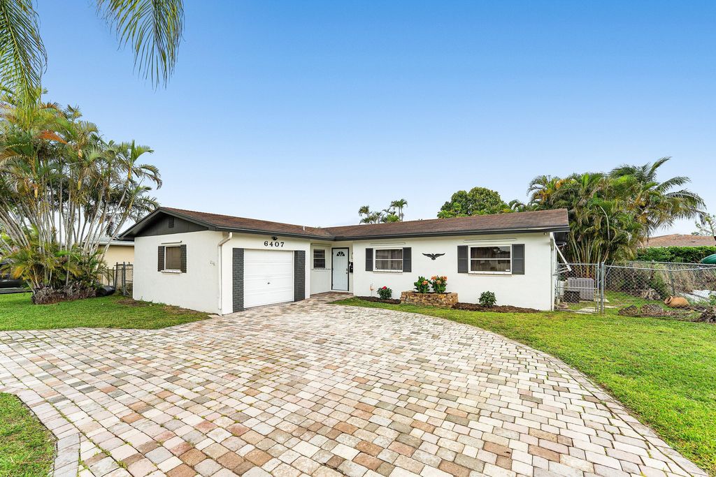 Photo of 6407 Boulevard Of Champions, North Lauderdale, FL 33068 (MLS # B26018736)