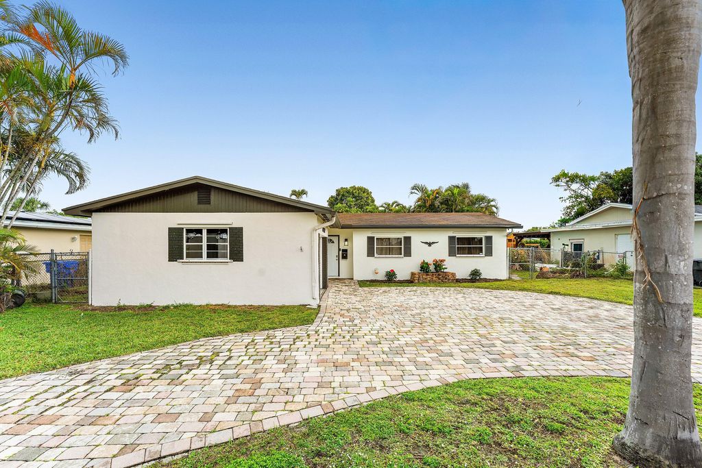 Photo of 6407 Boulevard Of Champions, North Lauderdale, FL 33068 (MLS # B26018736)