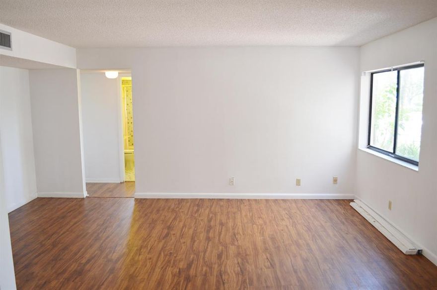 EZ access Deluxe End Unit 2/2 condo in desirable Las Verdes. Unit features updated laminate flooring throughout, fresh paint job, new bottom cabinets in kitchen and master bath that was redone several years ago. New blinds throughout and updated Water Heater. Long screened patio with large storage closet and storm shutters. Long grass views and right across the street from 1 of the community pools. No laundry in the unit, common laundry room down the hall next to mail room. 
Tons of ammenities and safe gated community that DID NOT LOSE POWER during Hurricane Irma, on updated Delray Medical Center power grid.