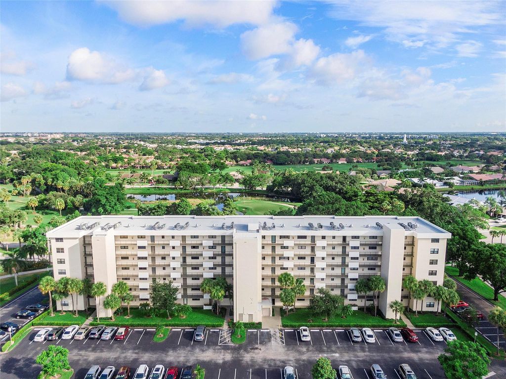 Photo of 2400 Deer Creek Country Club Blvd #202, Deerfield Beach, FL 33442 (MLS # F10540214)