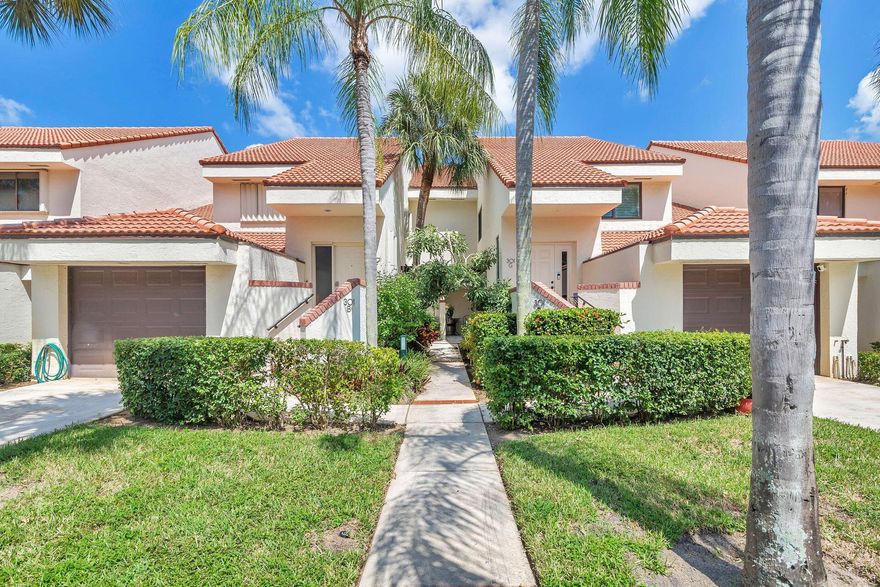 This first-floor condo offers step-free access and no carpeting, featuring vinyl plank flooring and tile throughout.  The condo has a wonderful tropical feel, from the front entrance to the lush greenery visible from the moment you walk in. The spacious primary suite is furnished with a king-size bed. The second bedroom includes built-ins, a fold-down desk, a full-size Murphy bed, and two comfortable chairs. An enclosed porch provides additional space for relaxation. The community features a newly renovated pool, lounging area & tennis courts. The location is ideal, just a short walk to beautiful beaches & close to excellent shopping, amazing restaurants, golf courses, and Abacoa, the spring training home for the Cardinals and Marlins.  PBI less than 30 min drive!