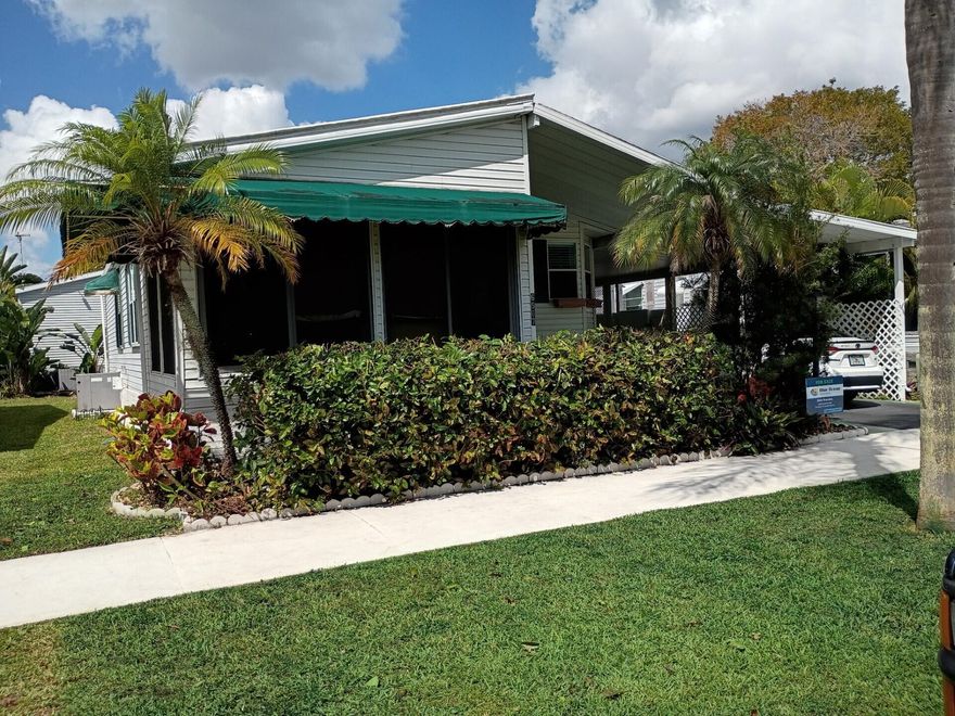 BEAUTIFUL HOME, WELL MAINTAINED WITH 2 BEDROOMS AND 2 BATH'S. CENTRAL AIR IS ONLY 6 YEARS OLD, WATER HEATER ABOUT 6 MONTHS OLD, STOVE,MICROWAVE AND LARGE SINK PURCHASED IN 2025. THIS HOME ALSO HAVE HURRACAINE WINDOWS AND SHUTTERS. LOCATED IN A 55+ COMMUNITY, ONLY A FEW MILES TO THE DESIRABLE BEACH OF DEERFIELD, THE WORRY-FREE SOUTH FLORIDA LIFESTYLE, WITH AMENITIES TO GALORE. CALL TODAY! IT WON'T LAST!!!  LOT RENTAL $1,015 MONTLHY.