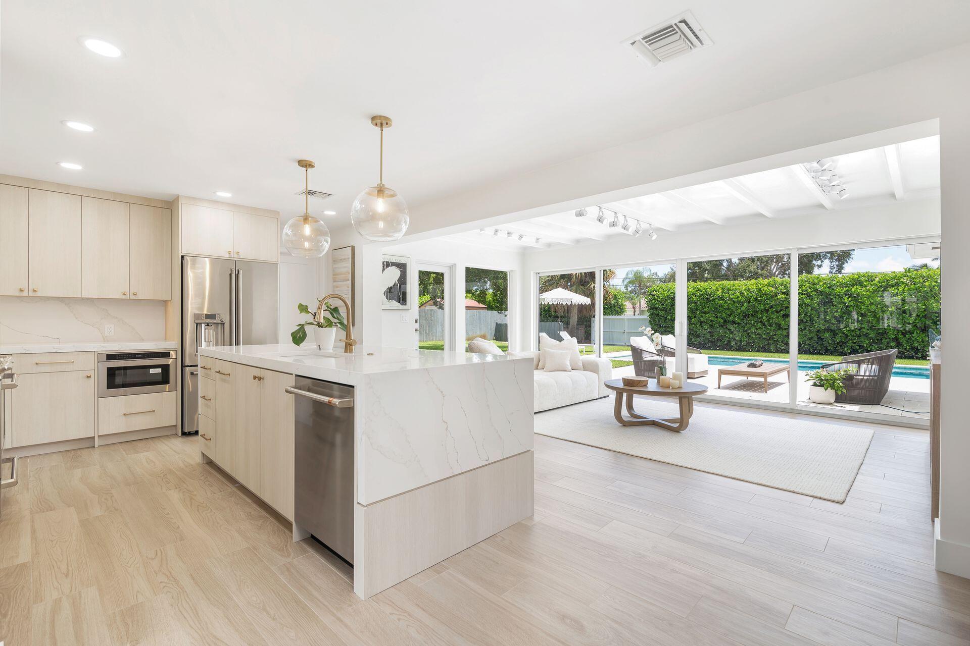 Fully Renovated Lake Clarke Shores Gem with Unique Dual Street Access & Brand-New Pool!Experience luxury living in this beautifully renovated 4-bedroom, 3-bathroom pool home, located in the highly sought-after lakefront community of Lake Clarke Shores. Completed in 2025, the full renovation and stunning addition were carried out by a licensed Florida general contractor, with all final inspections passed and permits closed.Situated on a rare, oversized lot under 14,000 sq ft, this property is one of only four homes in the neighborhood offering dual street access -- a truly unique feature. The one-car garage opens onto Pine Tree Street, while a secondary garage door and entrance face S. Lake Dr., providing the perfect setup for storing a boat, RV, golf cart, or additional