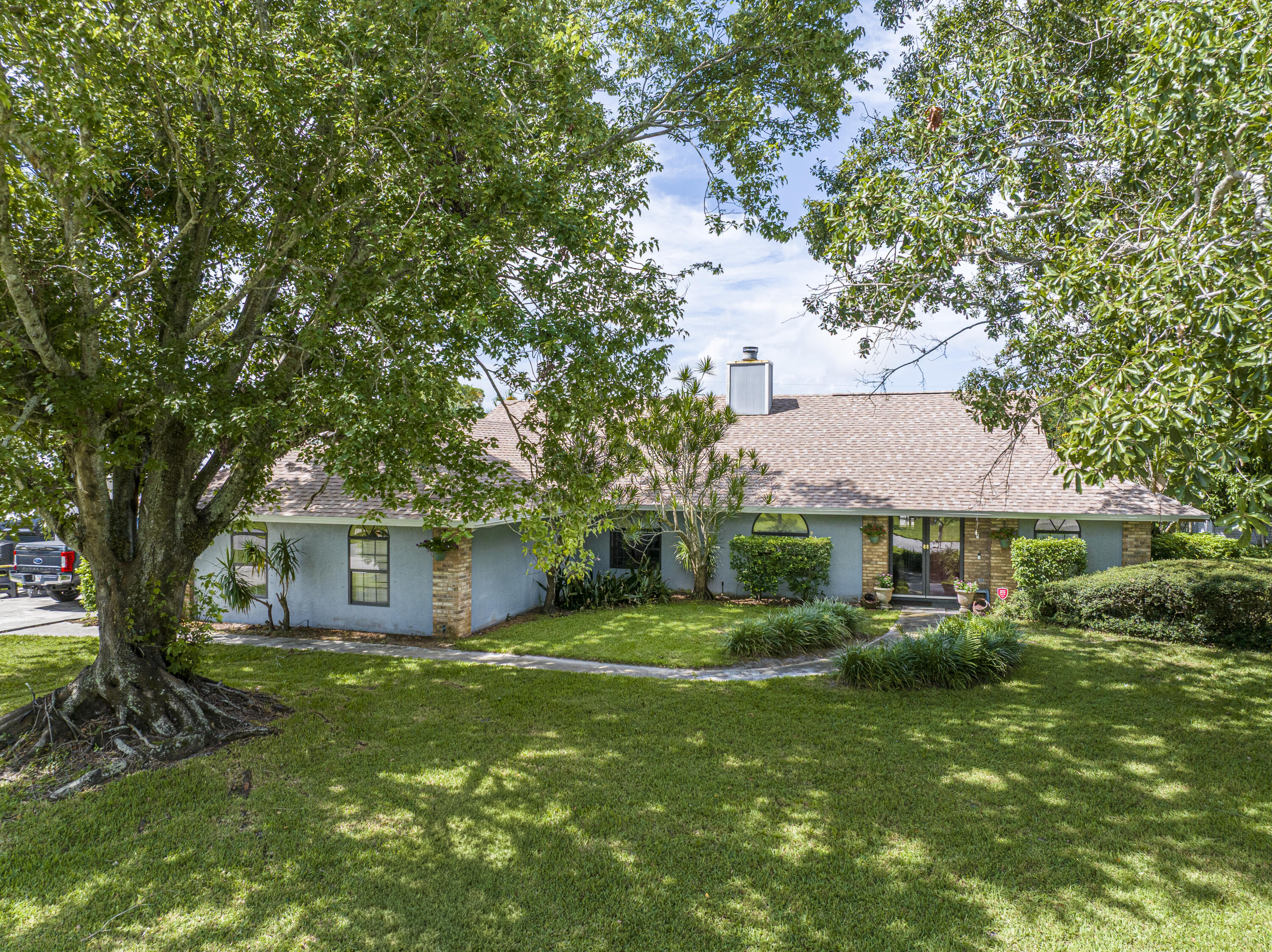 Live the Florida lifestyle in Sandpiper Bay! This beautifully updated 3-bedroom, 2-bath + den POOL home sits on nearly half an acre in one of Port St. Lucie's most sought-after non-HOA neighborhoods. Featuring a NEW ROOF and fresh interior paint, this move-in-ready home is full of modern upgrades. Inside, enjoy an open layout perfect for entertaining, with a 2023 A/C, new water heater, and new lanai screen. The sparkling 2017 pool is ready for summer fun, and a detached electric-powered shed offers a perfect space for hobbies or a workshop. Located just minutes from Jensen Beach, Treasure Coast Square, parks, golf courses, and top-rated schools, plus easy access to US-1 and the Turnpike for commuters.