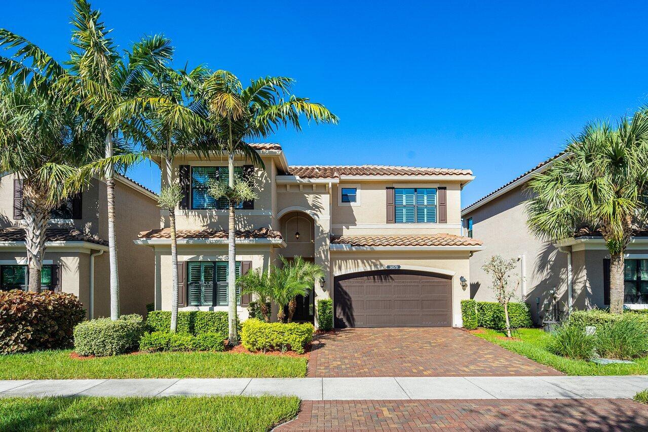 Available for annual lease! Built in 2016 by GL Homes, this spacious and highly sought after Milano model features 5BR, 3.1 BA, spanning 2,584 living sqft. The downstairs features the primary and one guest bedroom, 2 baths plus an open concept kitchen over looking a peaceful sparkling lake view. Backyard is fully fenced in! The kitchen boasts upgraded stainless steel appliances, soft-close cabinetry including a roll-out pantry, under-mount lighting, and quartz countertops. The primary bedroom is equipped with an oversized built-out custom walk-in closet, dual sinks with custom mirrors & a walk-in shower. More upgrades throughout include: plantation shutters, custom lighting, new ceiling fans fixtures, and custom built-in closets. Also Freshly painted throughout!