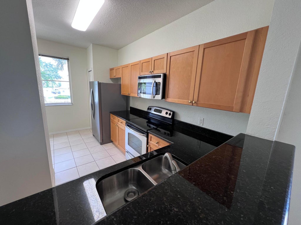Photo of 11037 LEGACY Boulevard #204, Palm Beach Gardens, FL 33410 (MLS # B26058509)