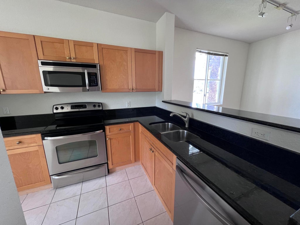 Photo of 11037 LEGACY Boulevard #204, Palm Beach Gardens, FL 33410 (MLS # B26058509)