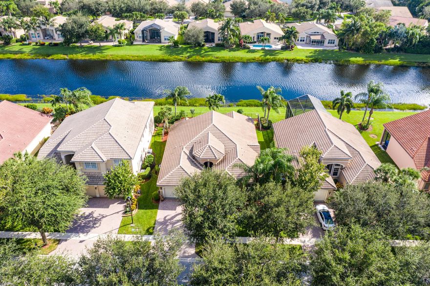 This gorgeous Madrid model features 3 bedrooms + den, 2.5 baths and beautiful lake views from the extended screen enclosed patio. Upgrade highlights include: a whole house generator, luxury vinyl planks, tons of kitchen and bath upgrades, solid core doors, central vacuum system, plantation shutters and Hunter Douglas blinds, custom closet systems, crown molding, French doors, front gutters, accordion shutters, upgraded landscaping and so much more. Please call for more details. HOA Fee includes lawn care, alarm monitoring, phone, cable and internet. Clubhouse recently renovated.