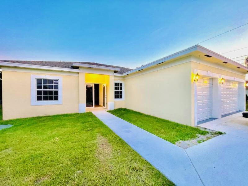 New Construction ready for move in.:Brand New Construction, 4 bedrooms, 3 baths, 3 car garage --Guest suite has kitchenette with own side entrance. Great area close to I- 95,, Turnpike and shopping. Volume ceilings, open concept with giant floating island. No Carpet, upgraded flooring. Granite Tops in kitchen and baths. Shower Tile to Ceilings, IMPACT WINDOWS AND DOORS. Separate his and hers walk-in closets. Upgraded stainless steel appliances. Ceiling fans, High efficiency A/C,. Garage Door opener, Laundry Tub, Just completed for immediate occupancy.