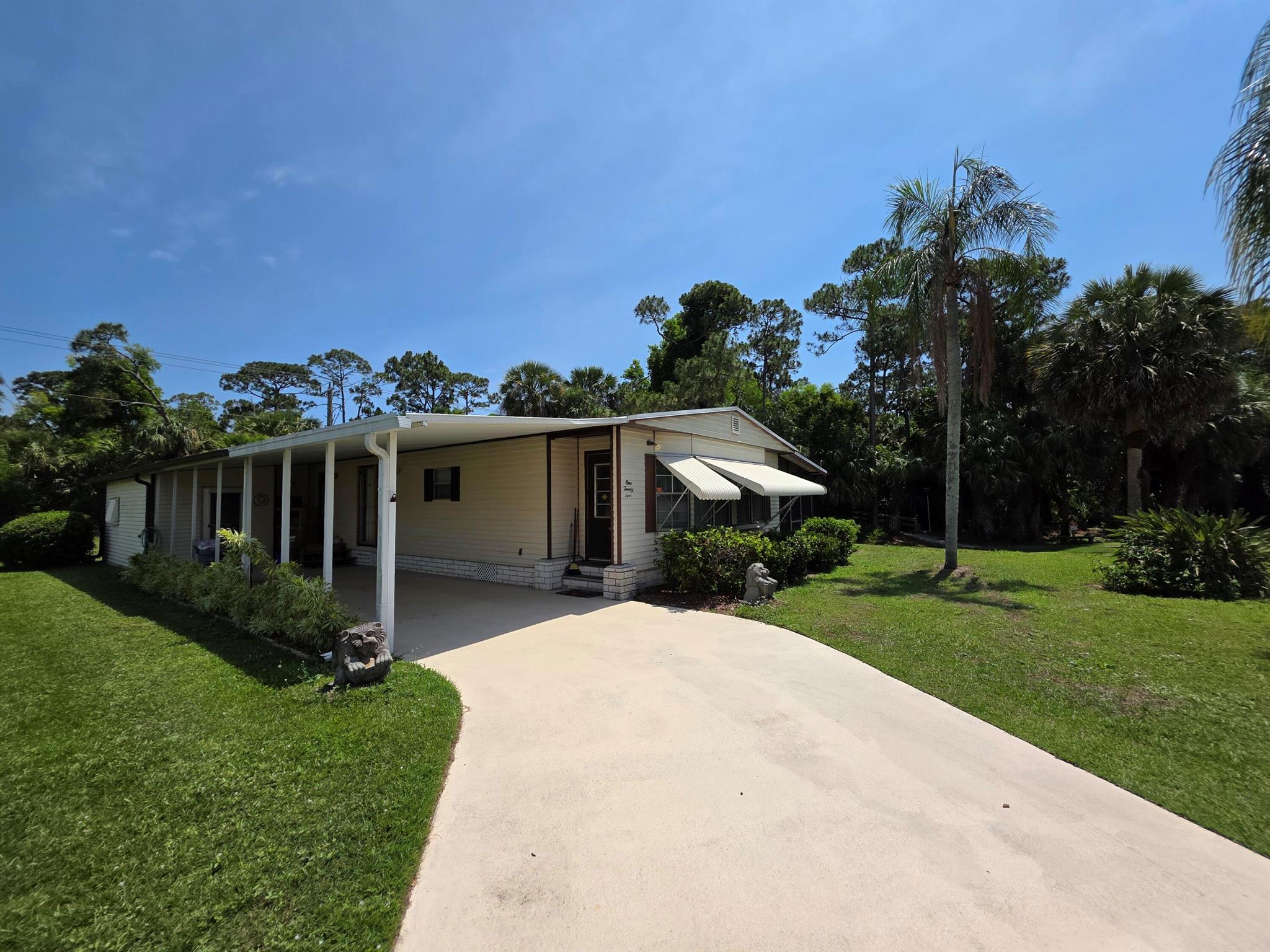 Welcome to your private retreat in Spanish Lakes Golf Village! This beautifully maintained 2-bedroom, 2-bath manufactured home is perfectly situated behind the tee box of the 8th hole, offering some of the most serene and unobstructed golf course views in the community. Enjoy your morning coffee or evening cocktail in peace, surrounded by lush greenery and the quiet charm of nature -- with no neighbors behind you. New roof in 2022 and A/C in 2018 offers peace of mind. Inside, the home offers a bright and spacious layout with a wet bar, ideal for entertaining guests or relaxing in style. Whether you're looking to unwind in comfort or entertain with ease, this home delivers the perfect blend of privacy, scenery, and low-maintenance. (Market Lot Rent 1,021.87)