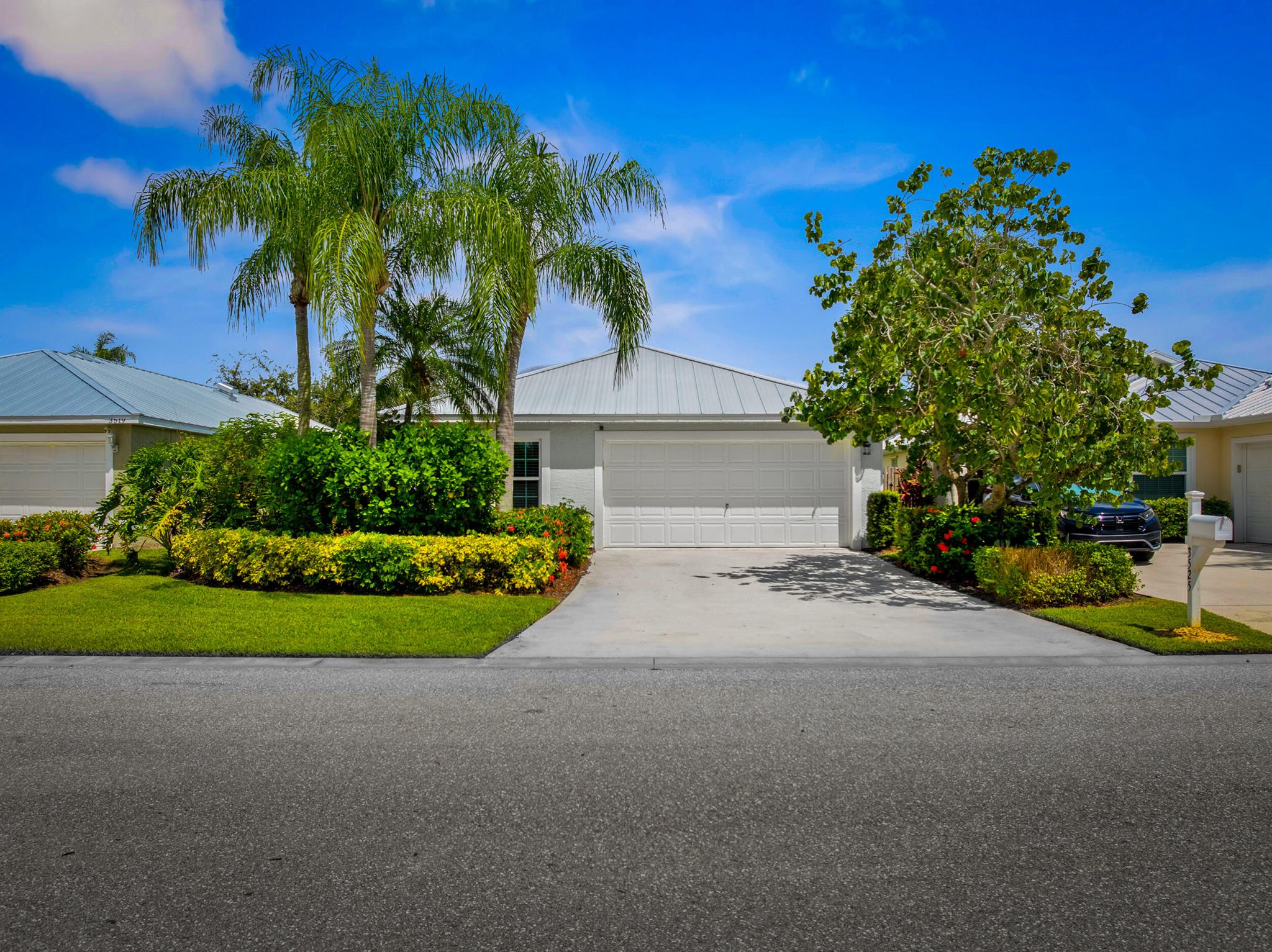 This CBS, move-in ready and exceptionally maintained 3/2/2 home is in a very sought after and popular community in Palm City. A-rated schools (middle school within walking distance), grocery stores, excellent restaurants and the beautiful beaches of Martin County. This home boasts a new standing seam metal roof installed May 2024, 2023 PGT vinyl impact glass windows throughout, 2019 Trane AC, 2023 complete exterior professionally painted, 2025 hot water heater, 2025 high end GE Profile dishwasher and refrigerator, 2024 LG washing machine, 2024 tiled front porch. Home also boasts luxury vinyl plank flooring in all living areas and master bedroom. Lowest HOA fee in Palm City at $325/month. Includes: full service property manager, accountant fees, front/side yard lawn maintenance, cable TV,