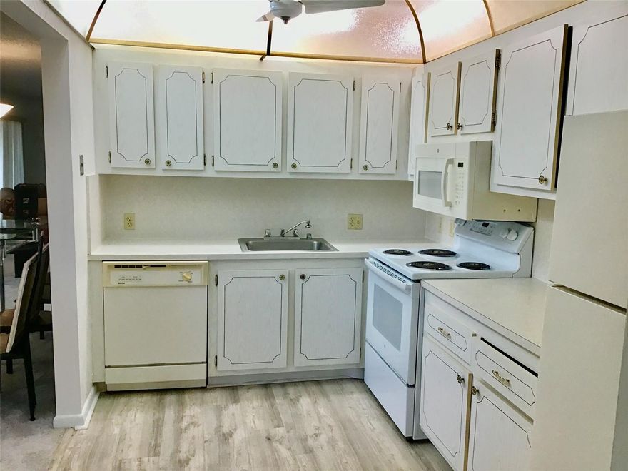 Light, bright, and spacious rarely available Model-C 1 bedroom, 1 bathroom 3rd floor unit with over 800 living square feet and central air conditioning in Century Village is available for annual or seasonal rent. Seasobal Rent is $2500 per month for a minimum of 4 months. This unit has been freshly painted, has newer carpet, a 2022 electrical panel, 2021 a/c and a brand new hot water heater. Master bedroom has a huge walk-in closet. Very large and open living area with two sets of sliders to the patio (great floor plan that rarely comes available). Large screened in patio and a lake view from the front of the building. Don't miss out on the opportunity to make this condo your own. 55+ dated adult community with great amenities including Clubhouse, Fitness Center, Pools, Tennis and more.