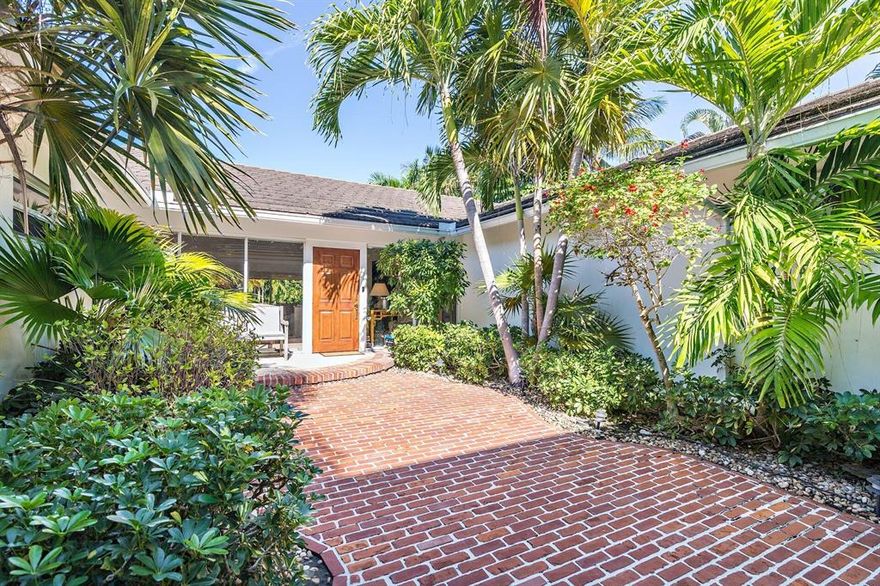 Enter through a lush courtyard into this spacious 5 bedroom, 4.5 bath home which is two houses from the Intracoastal on the very desirable Worth Court North just south of Southern Blvd. The house is very bright with well-proportioned rooms, vaulted ceilings and glass walls to the south and glass sliding doors to the north leading out to the covered patio and sparkling pool for gracious outdoor entertaining. This is one of the best areas in West Palm Beach as it is minutes from the airport, fine dining and shopping.