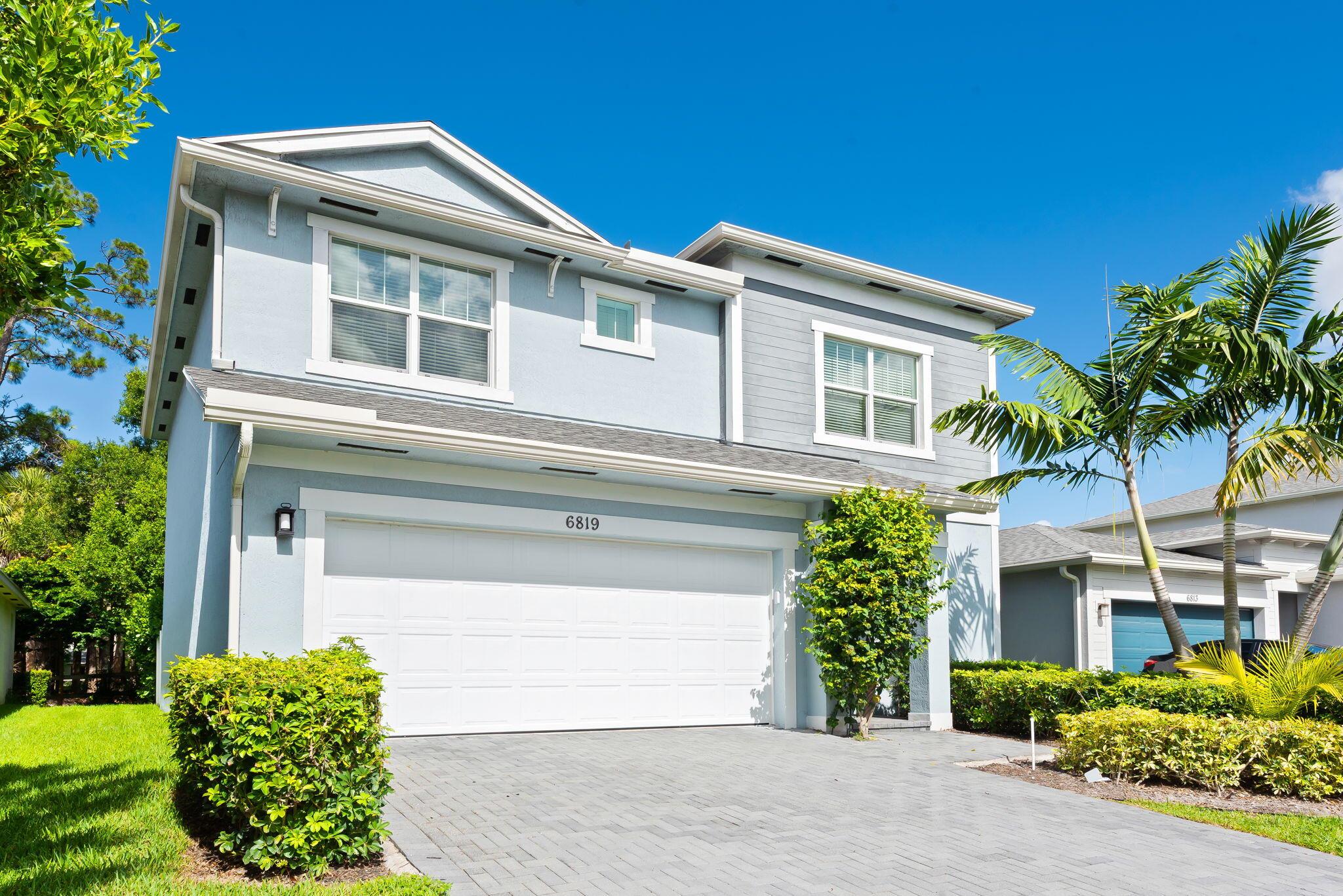 Built in 2021, New Everything, Low Insurance, Move-In Ready! Located in the gated community of Solcera that features a resort-style pool, playground, and dog park. Inside, the layout begins with a versatile flex room, then opens to a bright living dining area and a gourmet kitchen with abundant cabinetry and counter space. Sliding doors lead to a covered patio and fenced backyard that overlooks a lush landscaping area with oak trees. Upstairs, a spacious landing area with loft/den space connects to 3 bedrooms, including a generous primary suite. Enjoy low HOA fees, gated security, and easy access to I-95, Florida's Turnpike, top parks, Downtown WPB, and the area's best beaches.