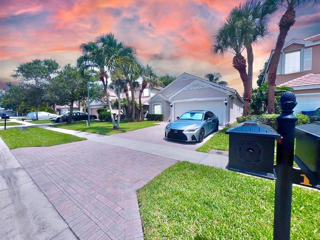 Photo of 137 Canterbury Place, Royal Palm Beach, FL 33414 (MLS # B26018125)