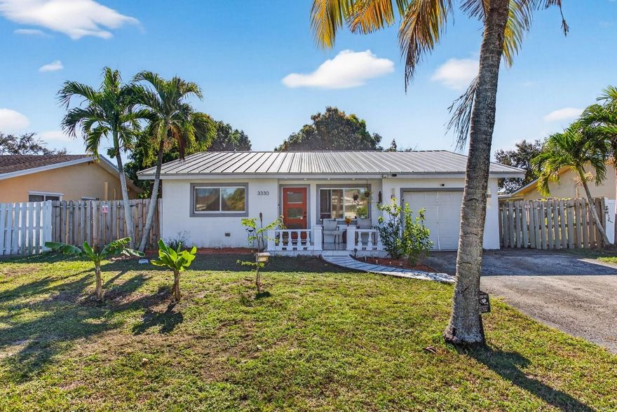 Beautifully renovated 3-bedroom , 2-bathroom home located in Palm Aire Village in Fort Lauderdale. Featuring a new metal roof (2023), AC unit (2025),  smart-home equipped appliances and extended living area, tile floors, a renovated kitchen and laundry area with all brand-new appliances; this home has been upgraded from top to bottom! Hurricane impact windows and doors throughout. Enjoy the spacious outdoor deck and garden oasis under the mango, banana and avocado tree canopies. This private, friendly community has no HOA and is ideal for homeowners and investors alike; the neighborhood is Airbnb and VRBO approved. Family & pet-friendly community, easy access to I-75 and I-95, within ten minutes of any necessity, and just 6 miles to the beach. Come see it today!
