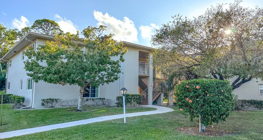 Vista St. Lucie is a beautiful, and active, 55+ community in a park-like setting, surrounded by nature.  This second-floor unit has garden and wooded views.  The A/C and water heater are newer, 2023.  Roof 2023.  Washer and dryer are located in the unit, just off the patio.  The bathroom vanities and mirrors were just replaced last year.  The monthly HOA fee includes, water, cable, Internet, trash, building insurance, maintenance of the grounds and common areas, management that is onsite, and the many recreational amenities.  These amenities include tennis, pickleball, billiards, a gym, pool, shuffleboard, library, arts and crafts room, and clubhouse with kitchen.  Convenient to shopping, dining, civic center, and beaches