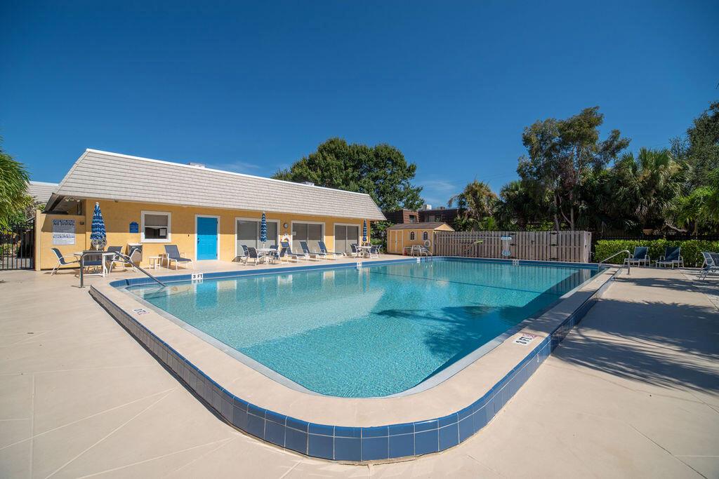 Fully furnished and turnkey, this 2-bed, 2.5-bath townhome in Tropic Villas North is available for an annual 12-month lease. The interior features luxury vinyl flooring throughout, an open main living area, and an in-unit washer and dryer for added convenience. Each bedroom includes its own private balcony, while the fenced-in patio provides a great outdoor space for relaxing or entertaining. Residents can also enjoy the community pool just steps away. Centrally located, this townhome is just a short distance from downtown Vero Beach, local shops & restaurants, and the sandy beaches of the Treasure Coast. Perfect for anyone looking to enjoy easy, maintenance-free living all year long.