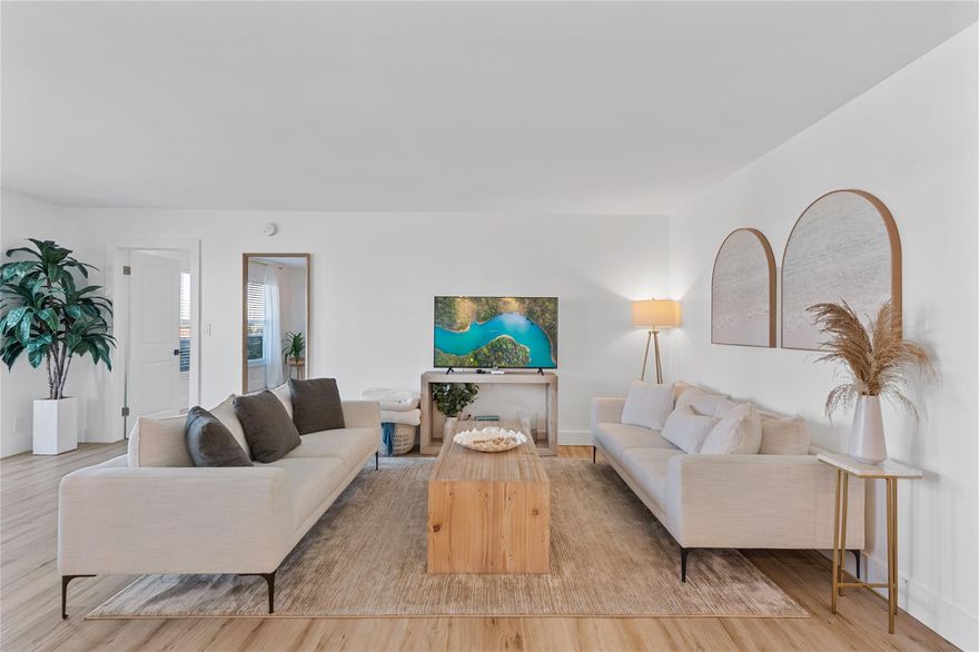 Truly spectacular condo with top of the line updates throughout. This unfurnished annual rental. 1209 sq ft large 1 bedroom 1.5 bath is a perfect beachfront condo. Sandy wood style tile throughout. Large kitchen with white quartz countertops, stainless steel appliances and shaker style cabinets. Also, bar seating area perfect for your morning coffee. Master bedroom with plenty of space for your bedroom furnishings. Large walk in shower with brushed gold shower head and handle. Unit has full size washer / dryer in kitchen. Garage spot. High impact windows and doors. Building amenities include two gyms, game room, large heated pool, gas grills, community room with two bars, library, car wash area, bike storage and more! Walking distance to grocery store, restaurants, entertainment and more!