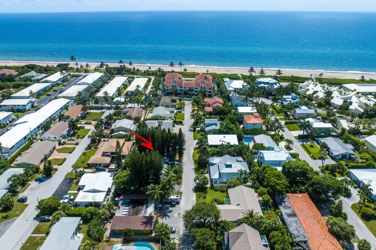 Discover the appeal of beachside living in this charming 2-bedroom beach bungalow duplex, just a brief stroll from the ocean and sandy shores. Nestled on tranquil Sailfish Lane, on a private cul-de-sac, this home offers private beach access and a coveted location East of A1A in prestigious Ocean Ridge, a hidden gem of a beach town. Ocean Ridge exudes an unparalleled sense of coastal charm, offering a peaceful escape from the bustle, all while being conveniently close to Delray Beach and mere minutes away from PBI airport. Your perfect beach retreat awaits in this idyllic enclave celebrated for its low-key beauty and coastal allure.