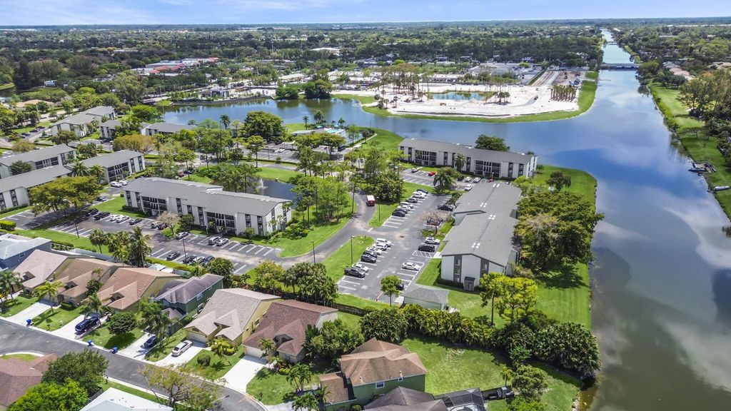 Photo of 150 Heatherwood Drive, Royal Palm Beach, FL 33411 (MLS # R11087006)