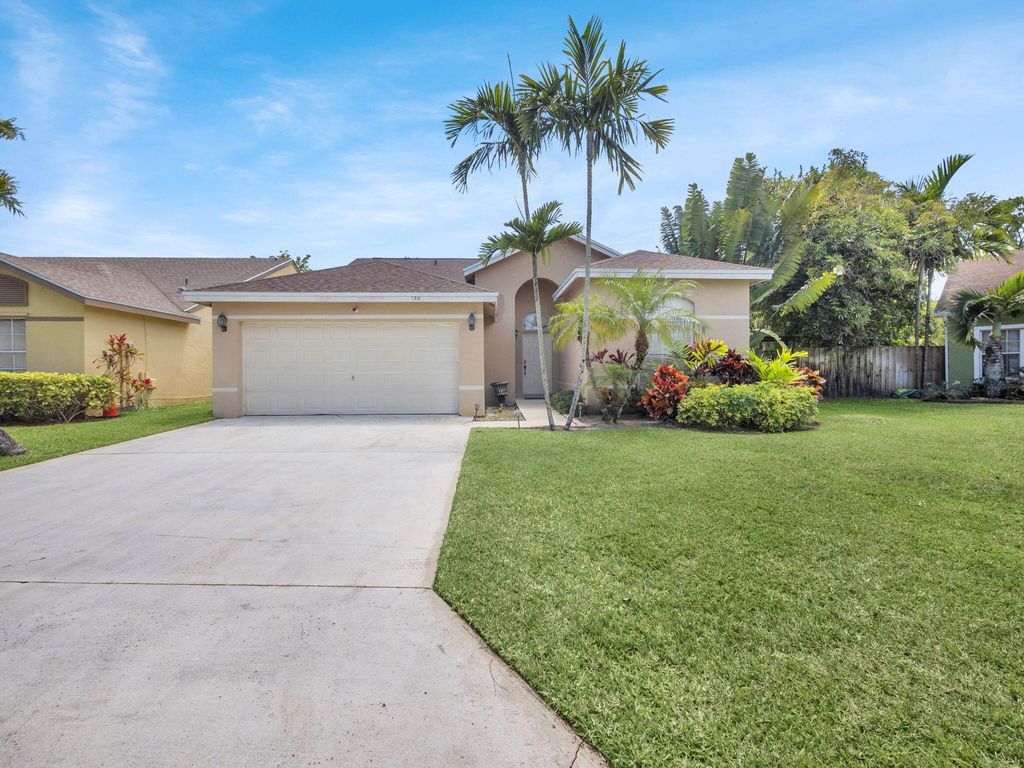 Photo of 150 Heatherwood Drive, Royal Palm Beach, FL 33411 (MLS # R11087006)