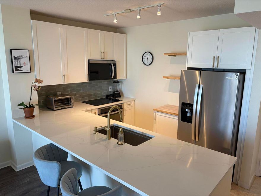 Great one bedroom one bathroom condo with updated kitchen at the Slade in West Palm Beach. Conveniently located on the intracoastal just minutes from prestigious Palm Beach with five star dining, shopping, and Beaches. Within walking distance of several restaurants and 10 minutes from Palm Beach international Airport. This resort style building features 2 infinity pools, the sunrise pool facing east and the sunset pool facing west Also features a hot tub, saunas, fitness center, club room with billiards and ping-pong as well as a business center. 24 hour concierge and valet parking. Come check this out, it won't last long!