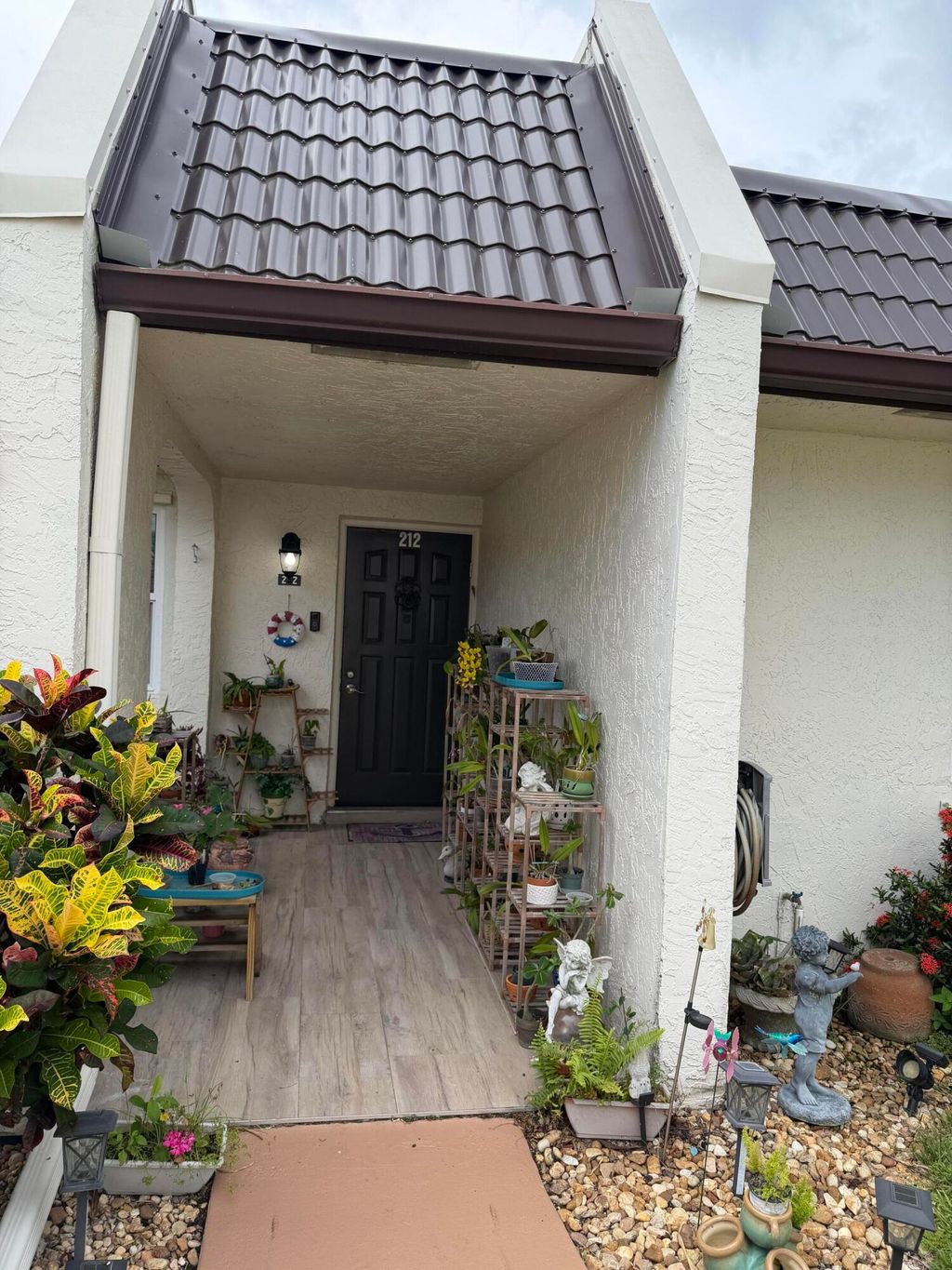 Photo of 212 Lake Susan Lane, West Palm Beach, FL 33411 (MLS # B26034412)