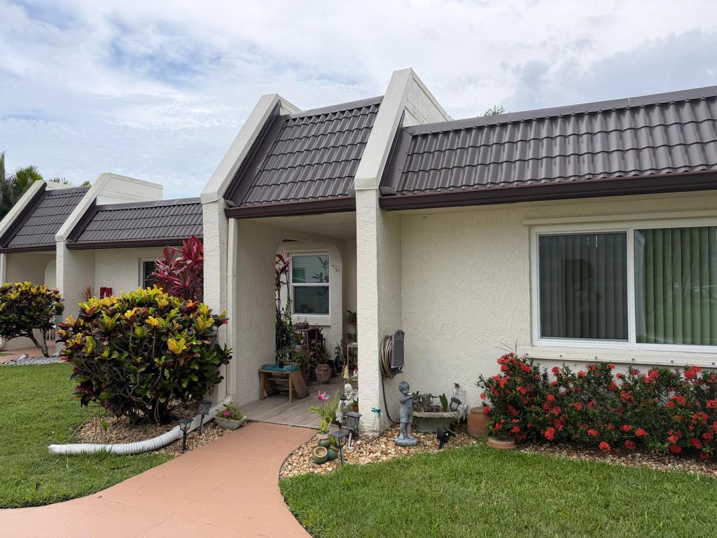 Photo of 212 Lake Susan Lane, West Palm Beach, FL 33411 (MLS # B26034412)