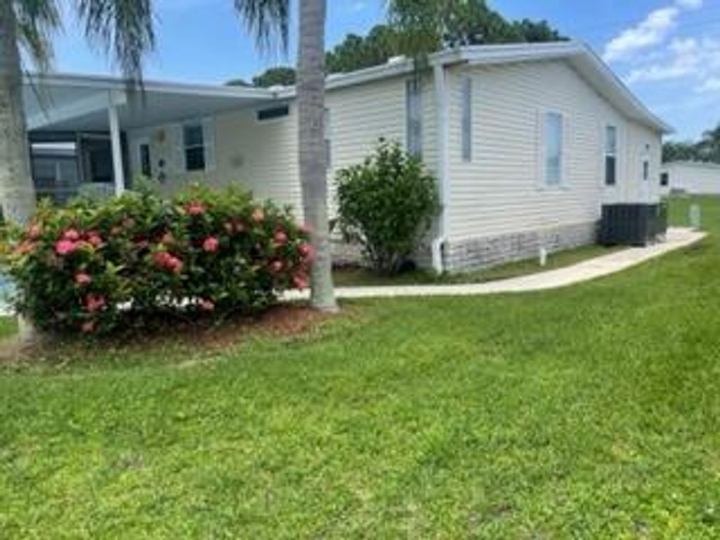 Photo of 7073 SE Birchwood Lane, Stuart, FL 34997 (MLS # R10903463)