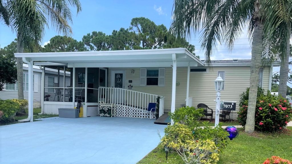 Photo of 7073 SE Birchwood Lane, Stuart, FL 34997 (MLS # R10903463)