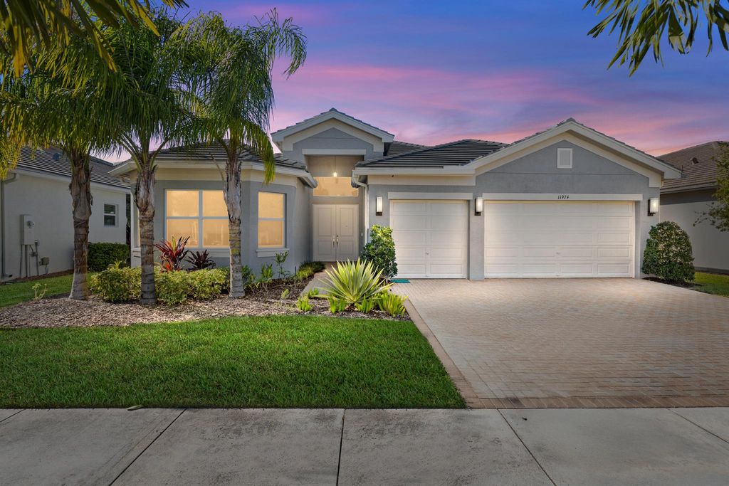 Photo of 11974 SW Laguna Bay Parkway, Port Saint Lucie, FL 34987 (MLS # R11141951)