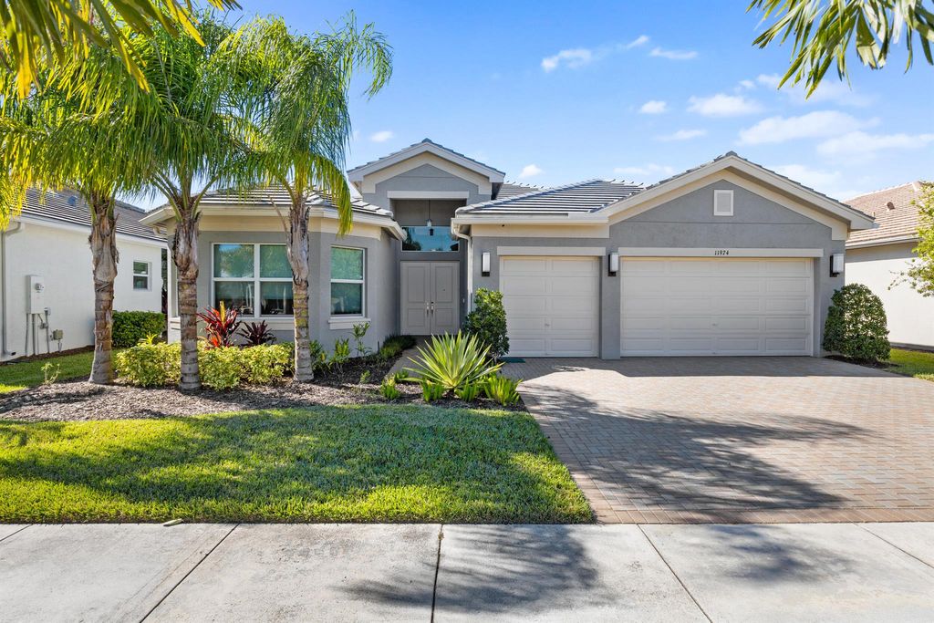 Photo of 11974 SW Laguna Bay Parkway, Port Saint Lucie, FL 34987 (MLS # R11141951)