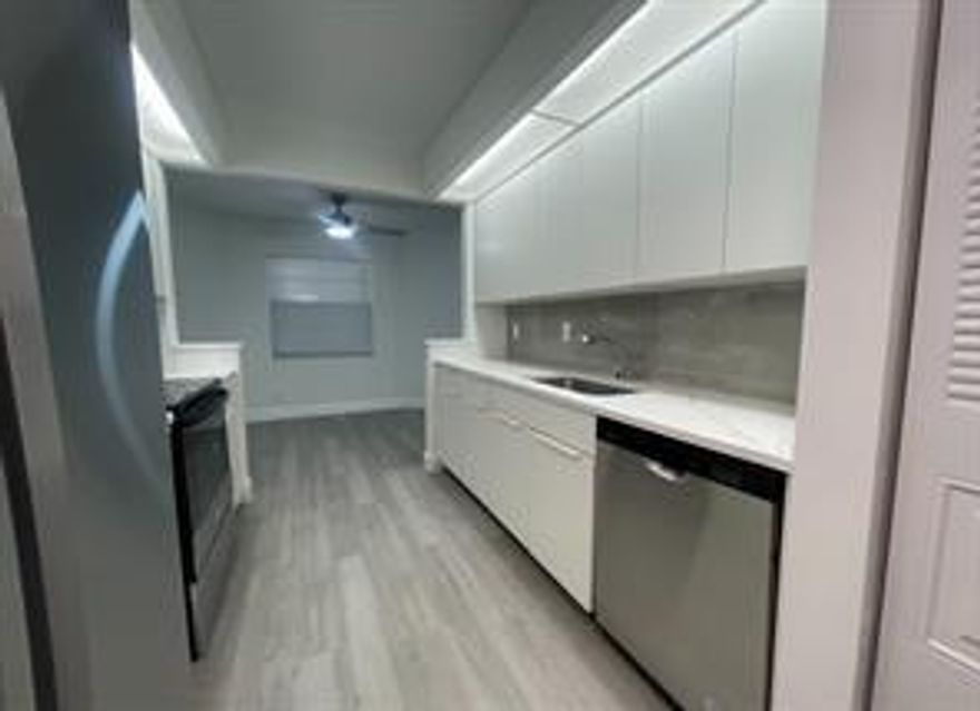 Beautifully updated 2BD/2BA condo in the highly desirable 55+ community of Wynmoor Village, offered at $2,294 for immediate rental! This light-filled home blends comfort, harmony, and balance with NEW appliances, fresh paint, and vinyl floors throughout. Enjoy an open kitchen, spacious walk-in closet, and the convenience of in-unit washer/dryer plus extra storage. Relax on your private patio or enjoy the resort-style amenities: heated pools, tennis, pickleball, fitness center, theater, golf course, clubhouse, shuttle service, and endless social activities. Assigned parking + plenty of guest spaces. Water and cable included. Perfect for those seeking a vibrant lifestyle with low-maintenance living. Move-in ready—don’t miss this opportunity!