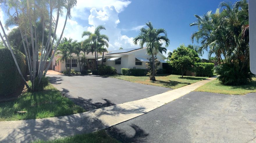 Wow remodeled home on large, fenced in, corner lot & 9 fruit trees. Hurricane Impact Windows,Granite counters, SS appliances: icemaker fridge, convection microwave oven, newer dishwasher, high grade cabinets w. self-closing drawers & under cabinet lighting. Consistent elegance w. Tile floors on a diagonal throughout. Both bathrooms Remodeled. Large master- double sink & handicap accessible shower. Solar panel system was installed for $25k / 25 year warranty, coupled with high efficiency AC & R30 attic insulation, drastically reduces energy bills. New hot water heater. Large patio. Separate gated driveway for access to covered boat or RV storage. Bonus storage shed. Sprinkler system, five zone, on well water. Newer underground electrical service / 200 amp panel & generator hookup. ENJOY!