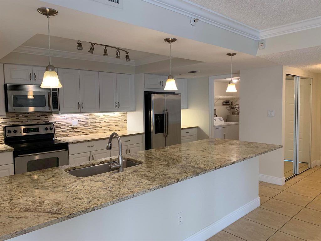 Photo of 820 Lavers Circle #G404, Delray Beach, FL 33444 (MLS # R10970689)