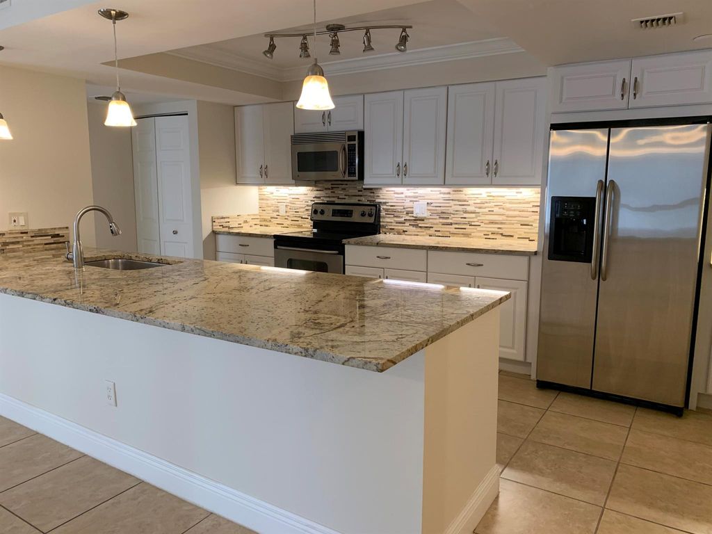 Photo of 820 Lavers Circle #G404, Delray Beach, FL 33444 (MLS # R10970689)