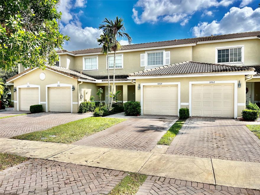 Tile first floor , laminated 2nd floor, granite countertop, lake view, one car garage.